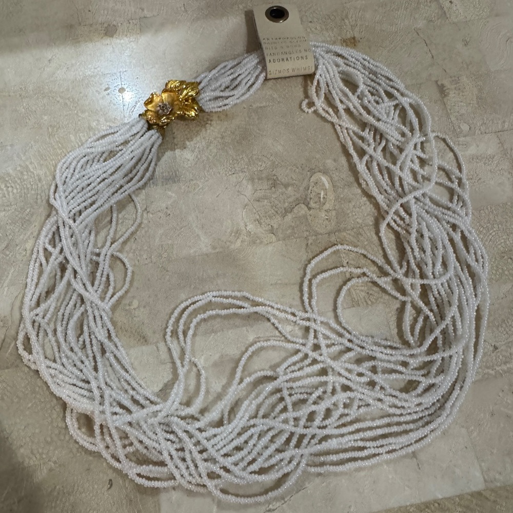 Anthropologie White Beaded Necklace with Gold Floral Accent
